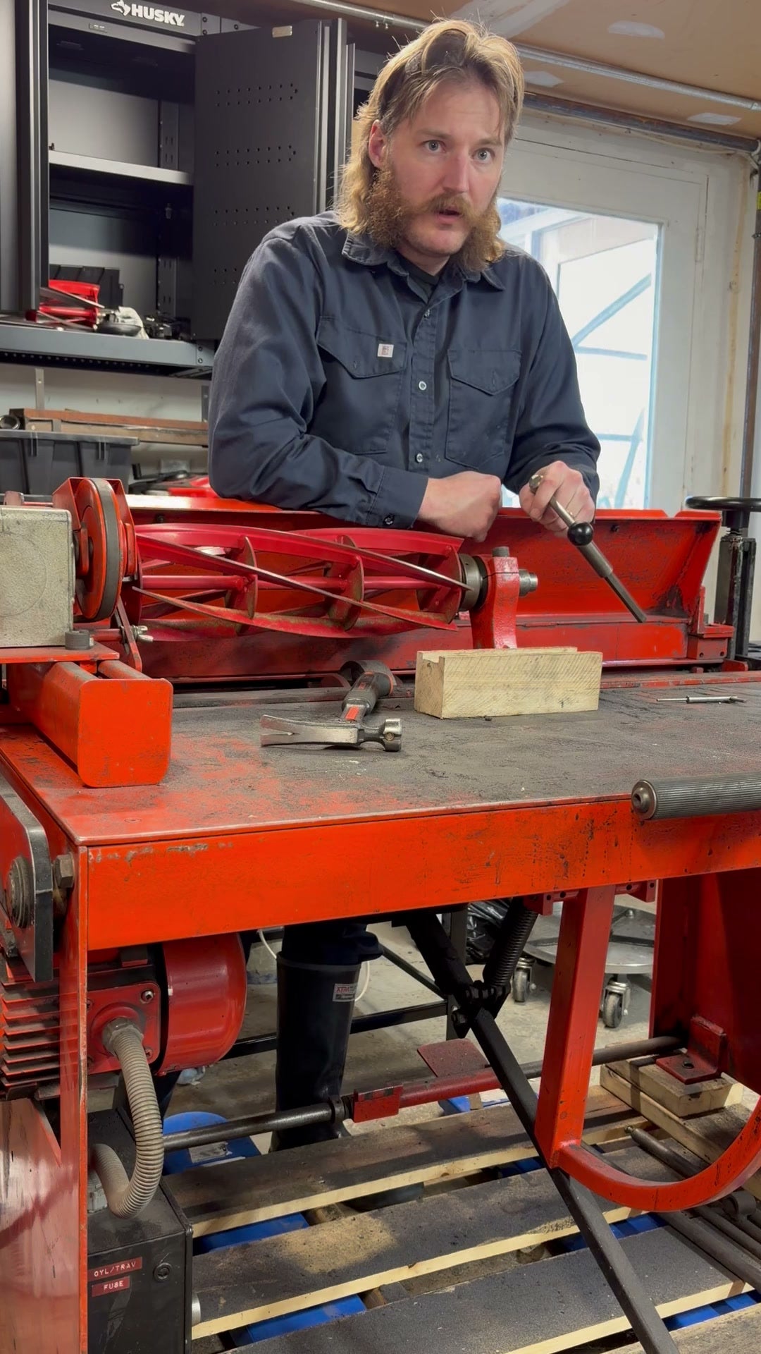 Allett Canada technician explaining the reel grinding setup at the grinding machine