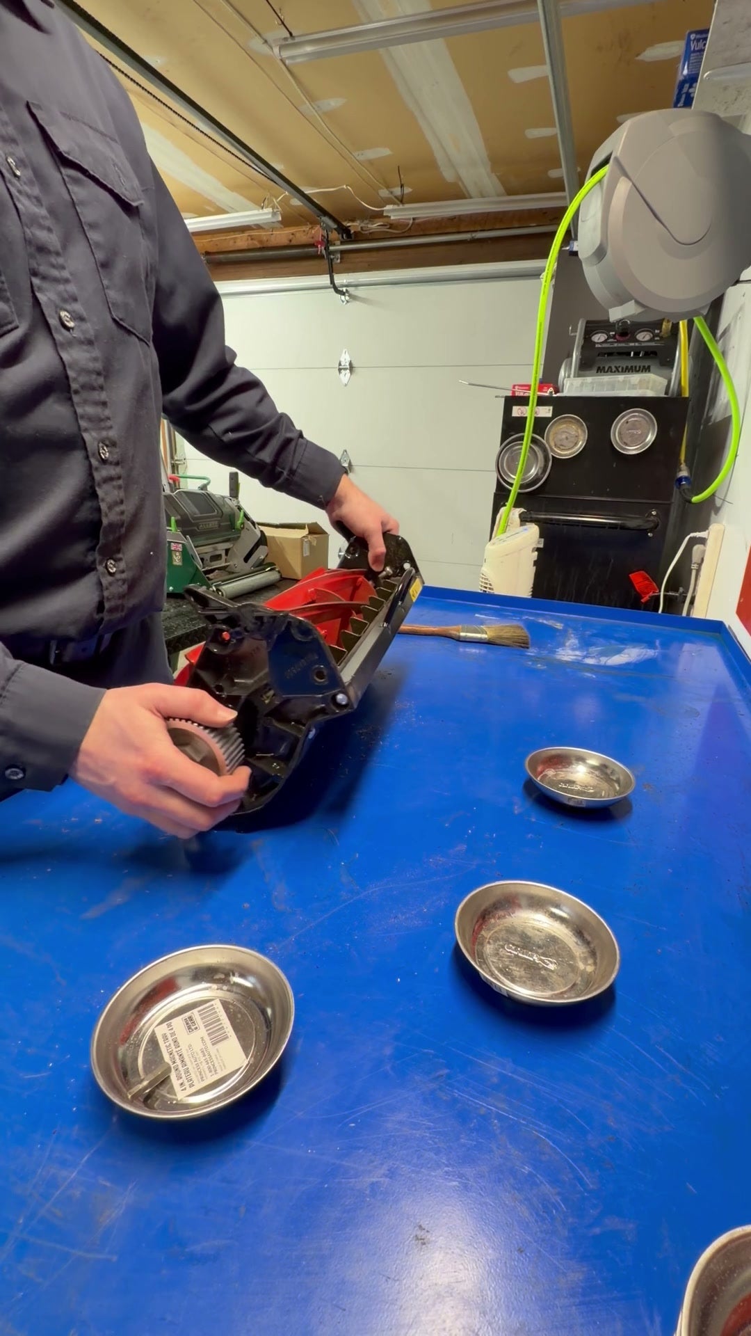 Allett reel cartridge being professionally disassembled for grinding service